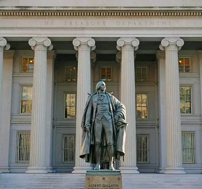 Statue in front of a government building.
